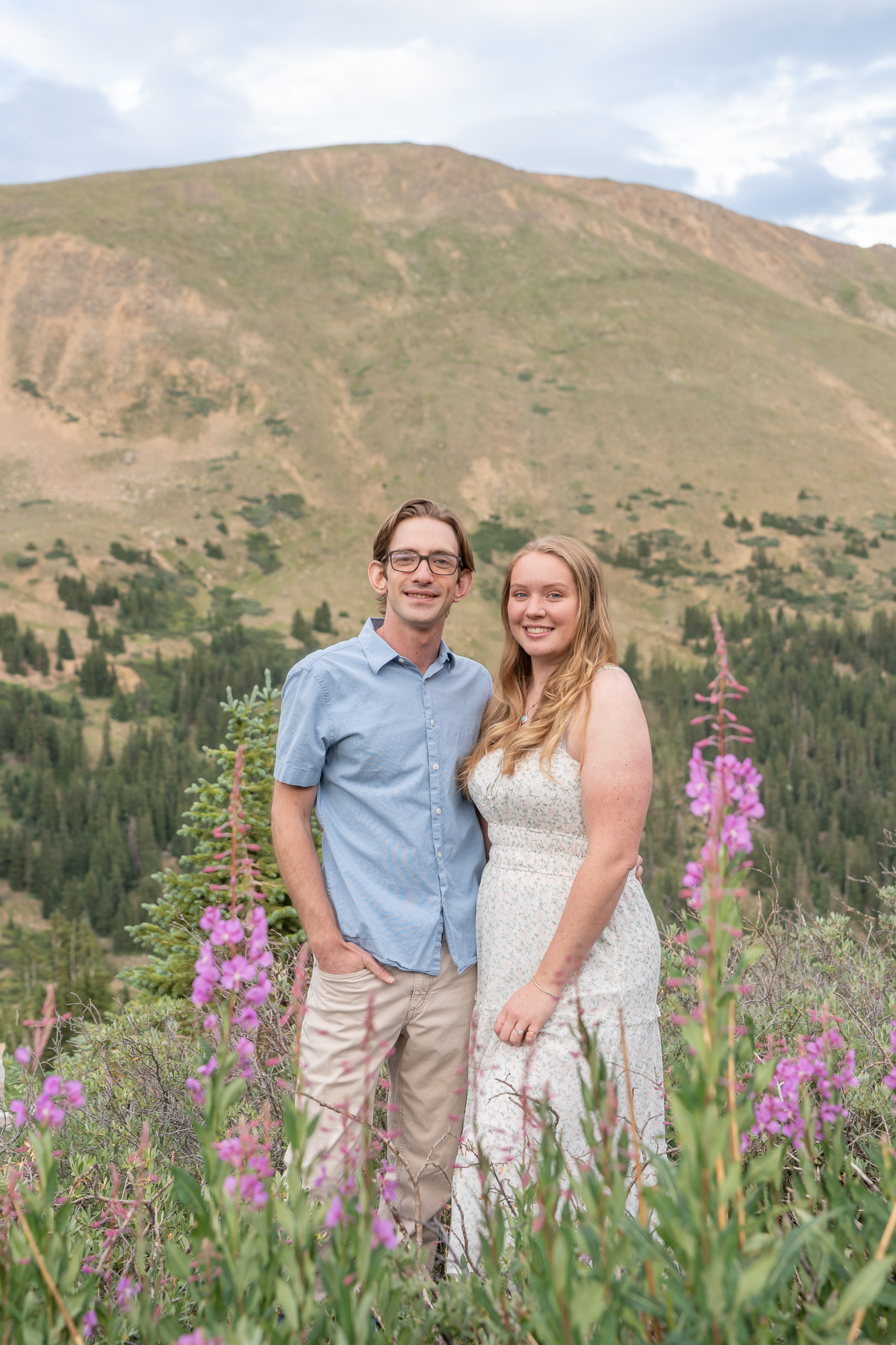 Jerome and Reese standing among alpine wildflowers